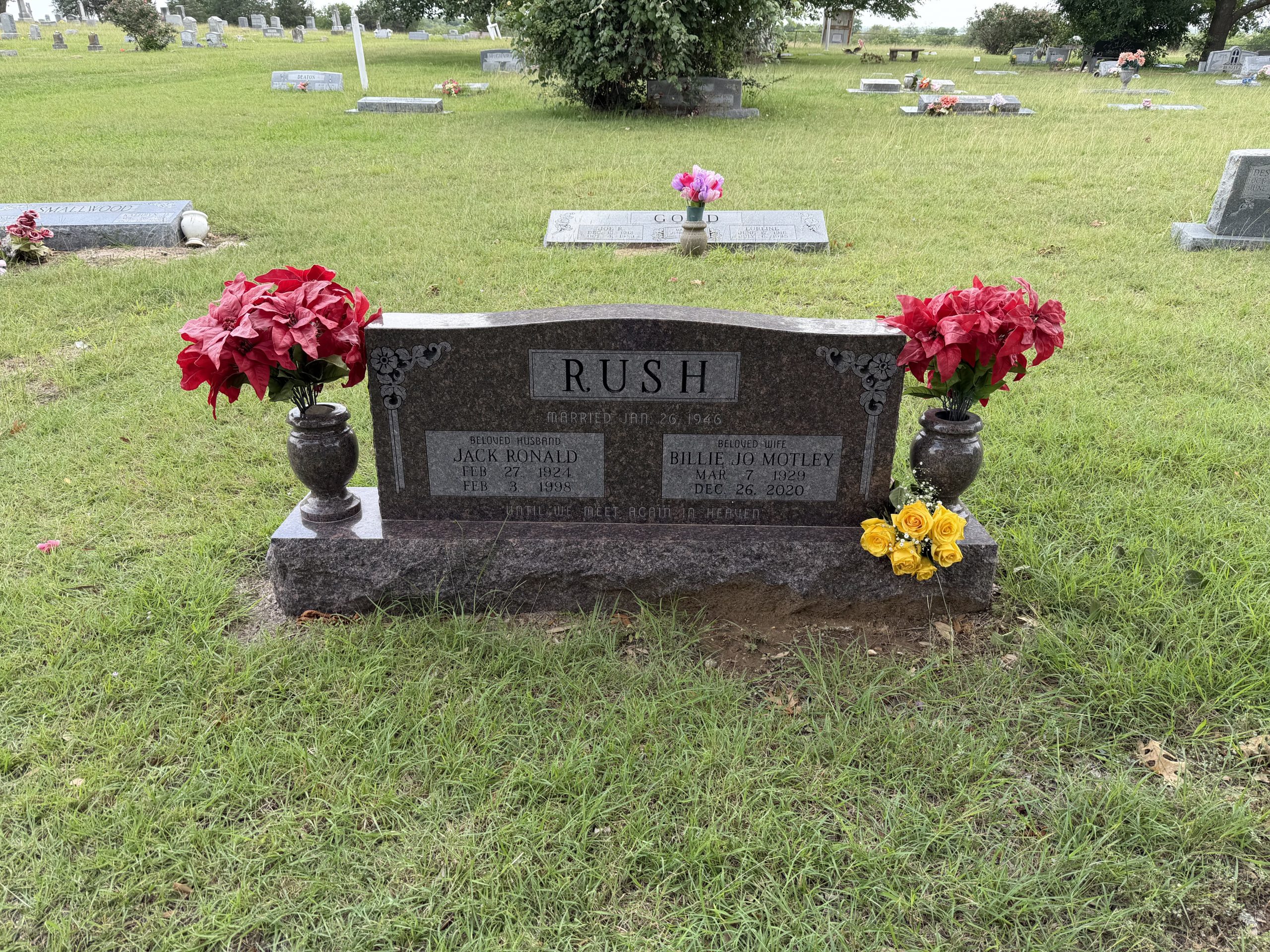 Grandparents' headstone with yellow roses